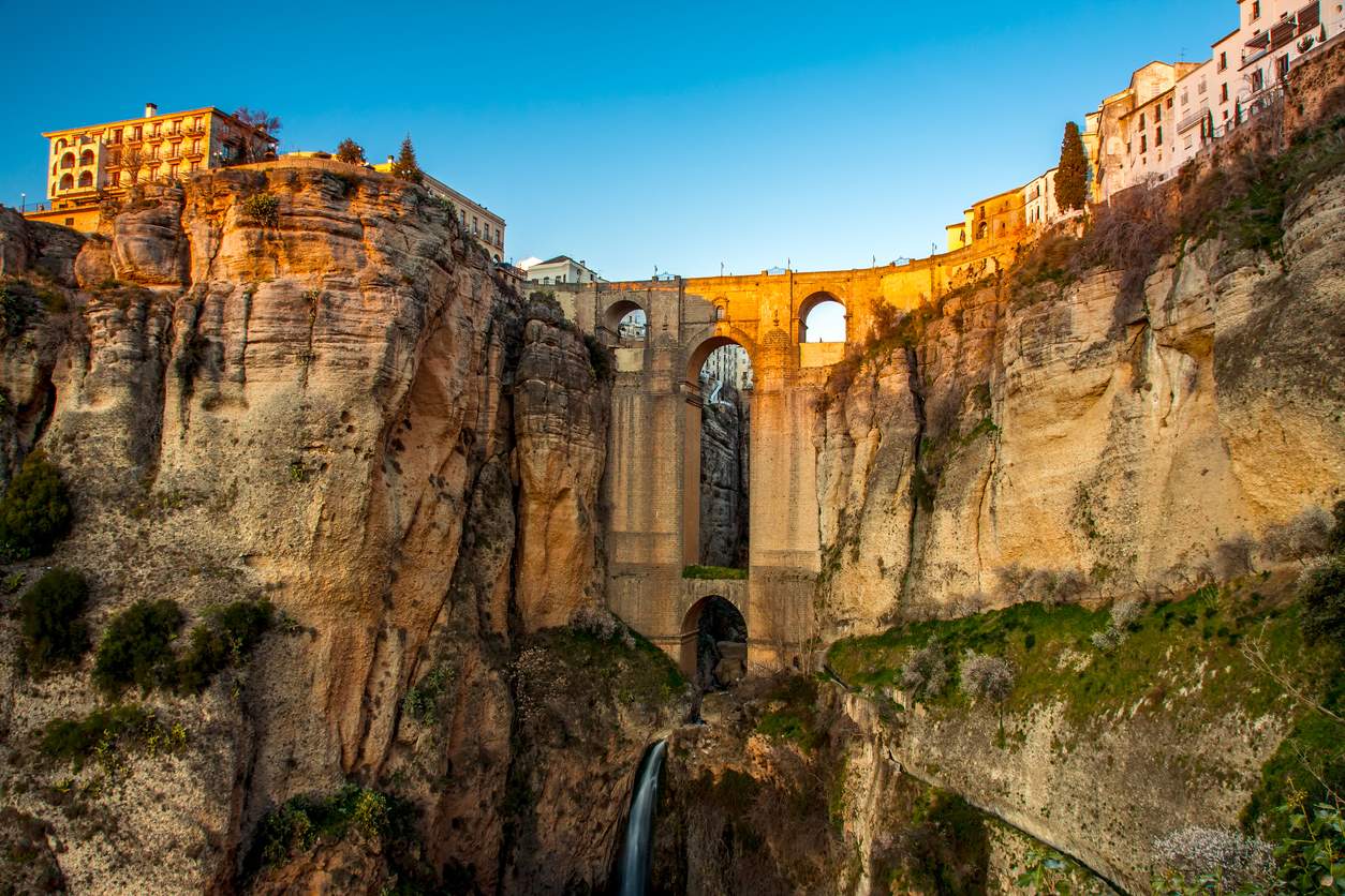 Ronda is a mountaintop city in Spain’s Malaga province that’s set dramatically above a deep gorge. This gorge (El Tajo) separates the city’s circa-15th-century new town from its old town, dating to Moorish rule.
